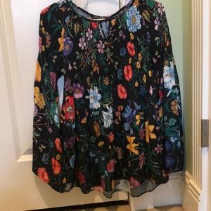 s black floral patterned blouse